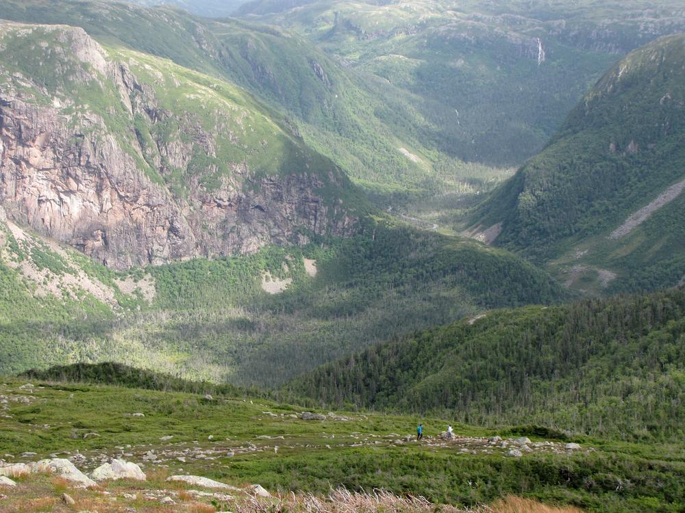 Two hikers seen in the distance on Gros Morne Mountain
