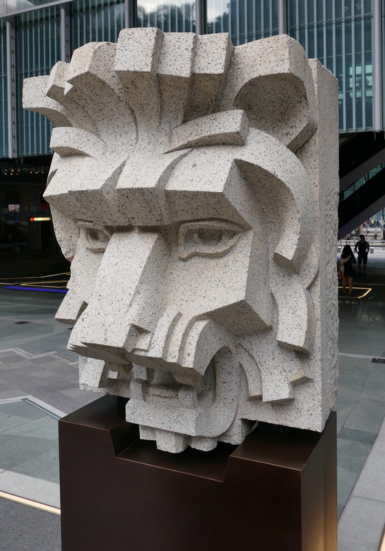 Angular stone lion head sculpture found at one of the bank buildings.