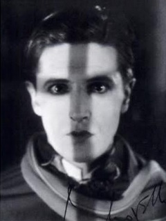 Ivor Novello with the shadow of a cross on his face
