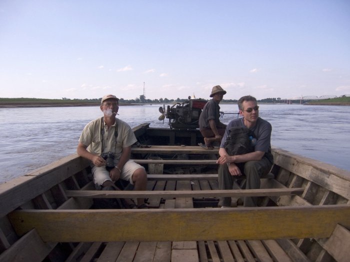 Me and Claus in a boat being ferried across a river.