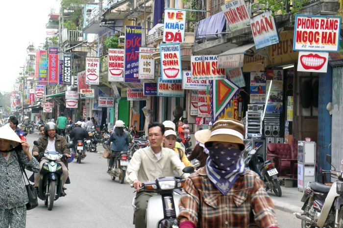Street in Hué with lots of smile signage