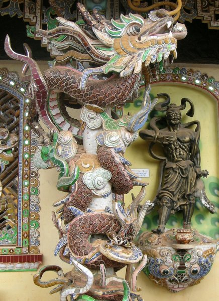 A ceramic dragon wrapped around a pillar